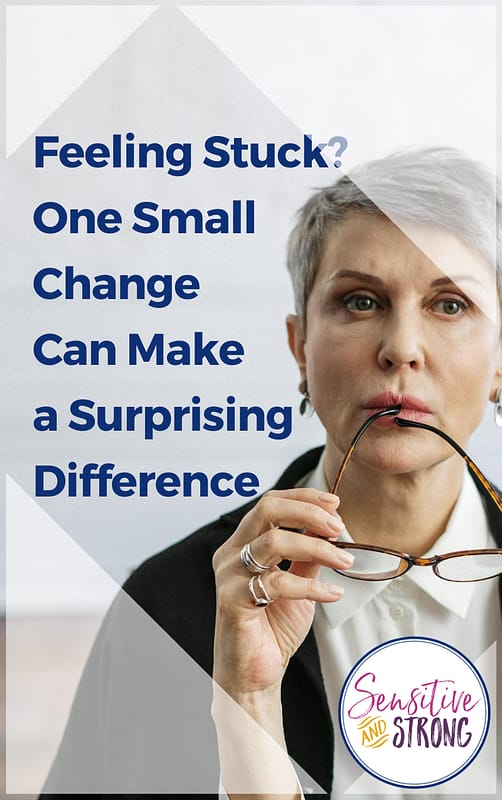 mature woman looking pensive and holding her glasses as if she's feeling stuck and is not sure how to get out of her rut